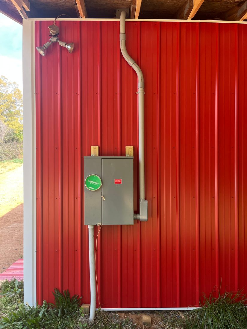 Electrical service panel installed in a barn