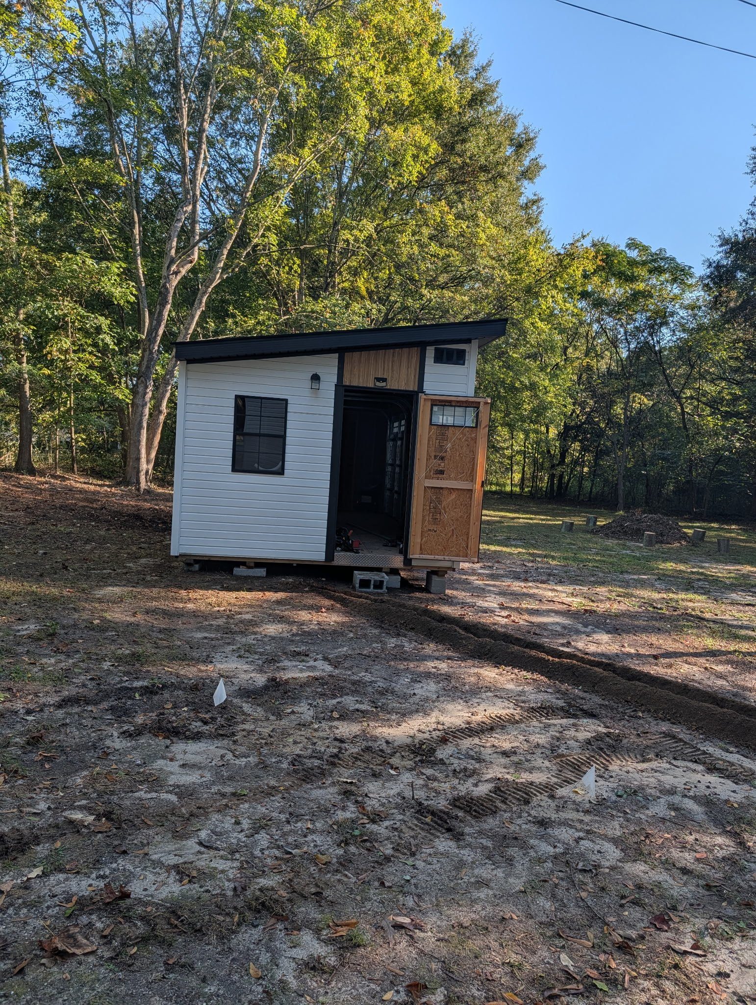 Trench run bringing electrical power from the house to a new shed